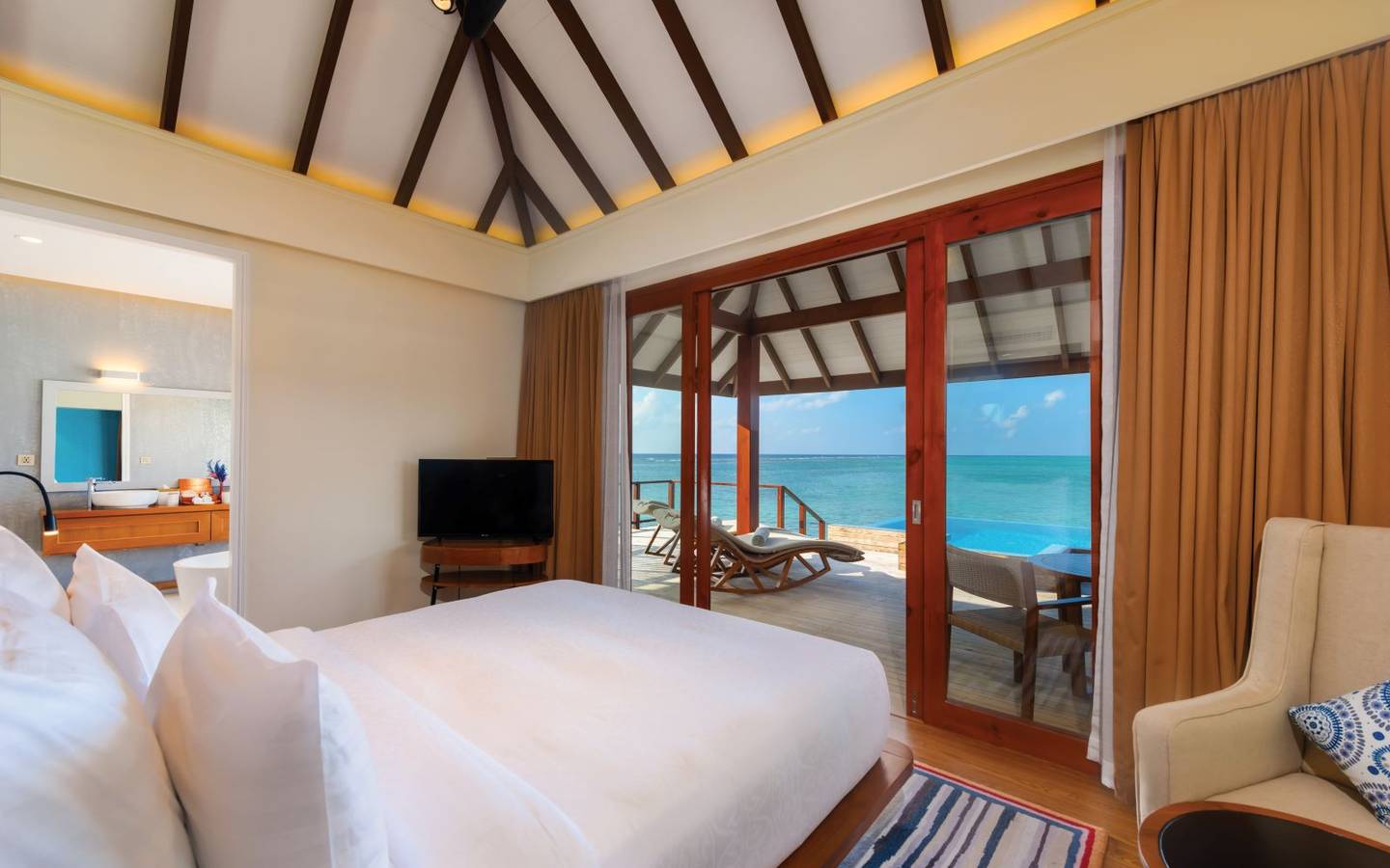 varu-by-atmosphere-maldives-water-villa-with-pool-bedroom-view