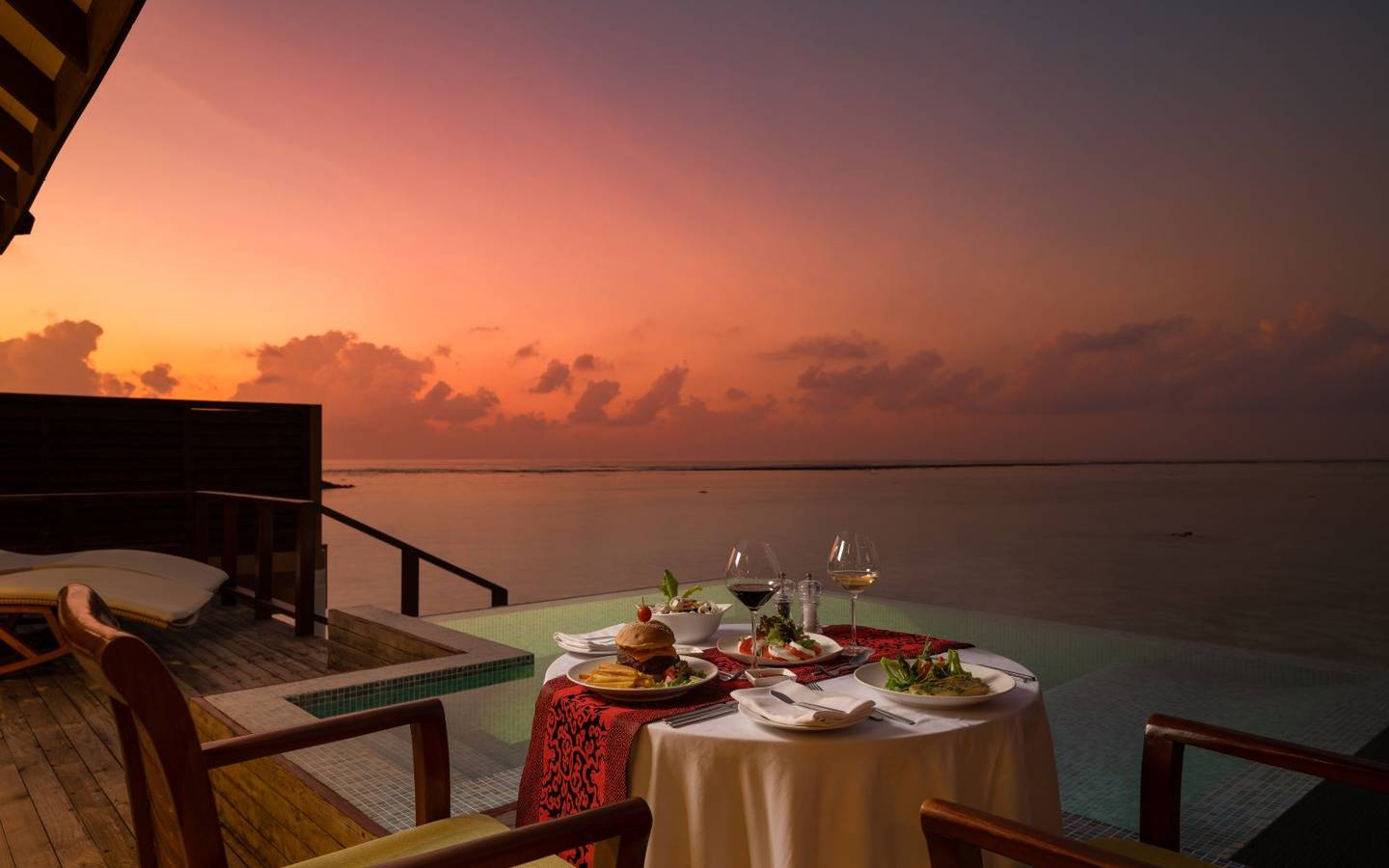 varu-by-atmosphere-maldives-water-villa-with-pool-sundeck-dinner-sunset