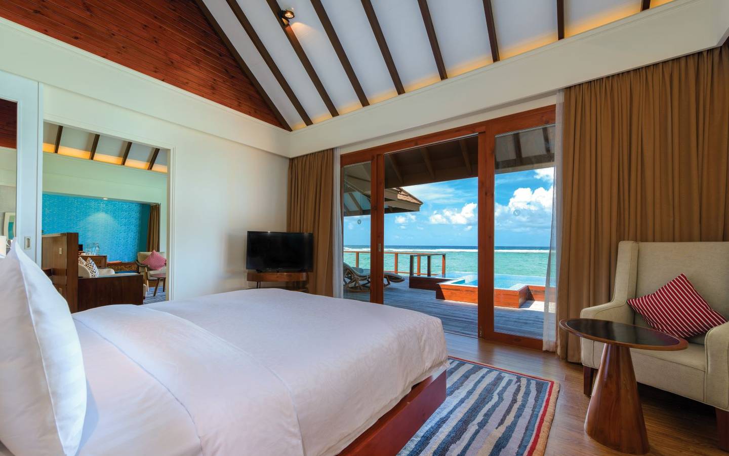 varu-by-atmosphere-maldives-water-suite-with-pool-bedroom-view-day