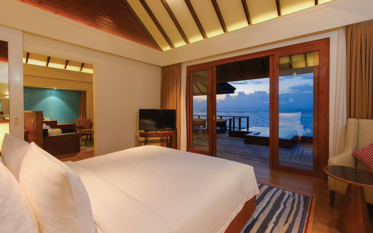 varu-by-atmosphere-maldives-water-suite-with-pool-bedroom-view