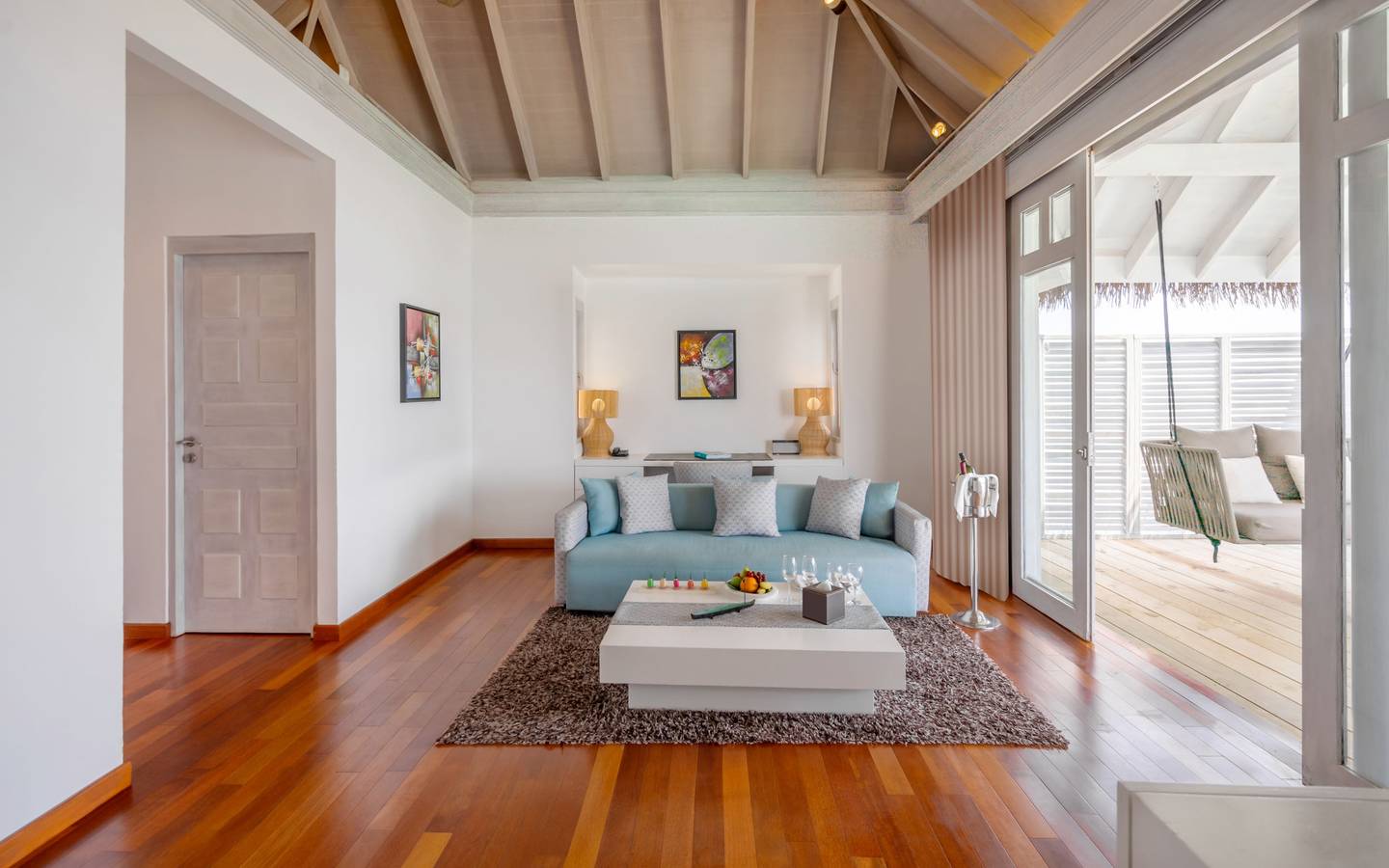 NH_Maldives_Kuda_Rah_Resort_Over_Water_Suite_with_Private_Pool_Living_Room