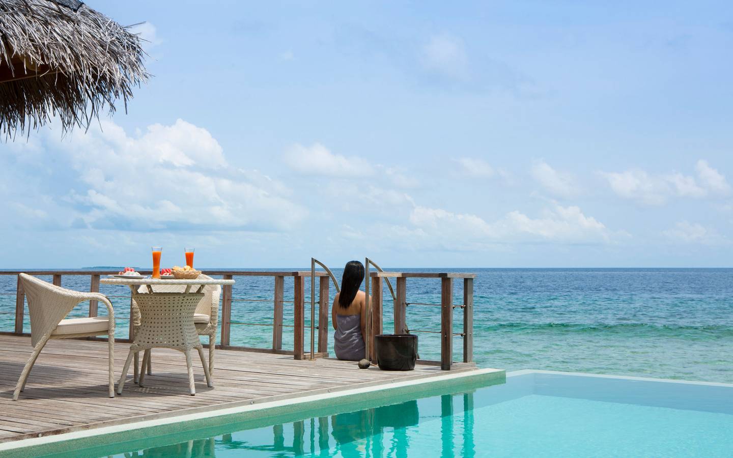 dusit-thani-maldives-accommodation-two-bedroom-ocean-pavilion-bedroom-lifestyle