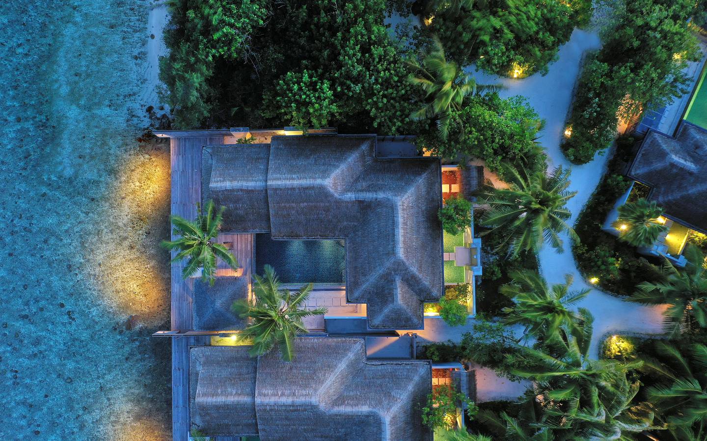 Naladhu_Private_Island_Maldives_Guest_Room_Ocean_House_with_Pool_and_Beach_Cabana_Aerial_Twilight