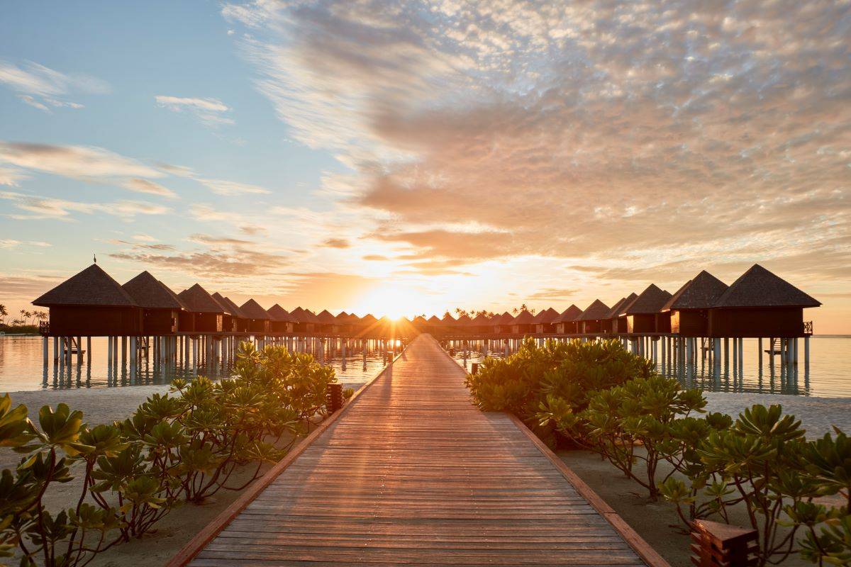Sun Siyam Olhuveli, Malediven, Water Villa, Wasservillen bei Sonnenuntergang