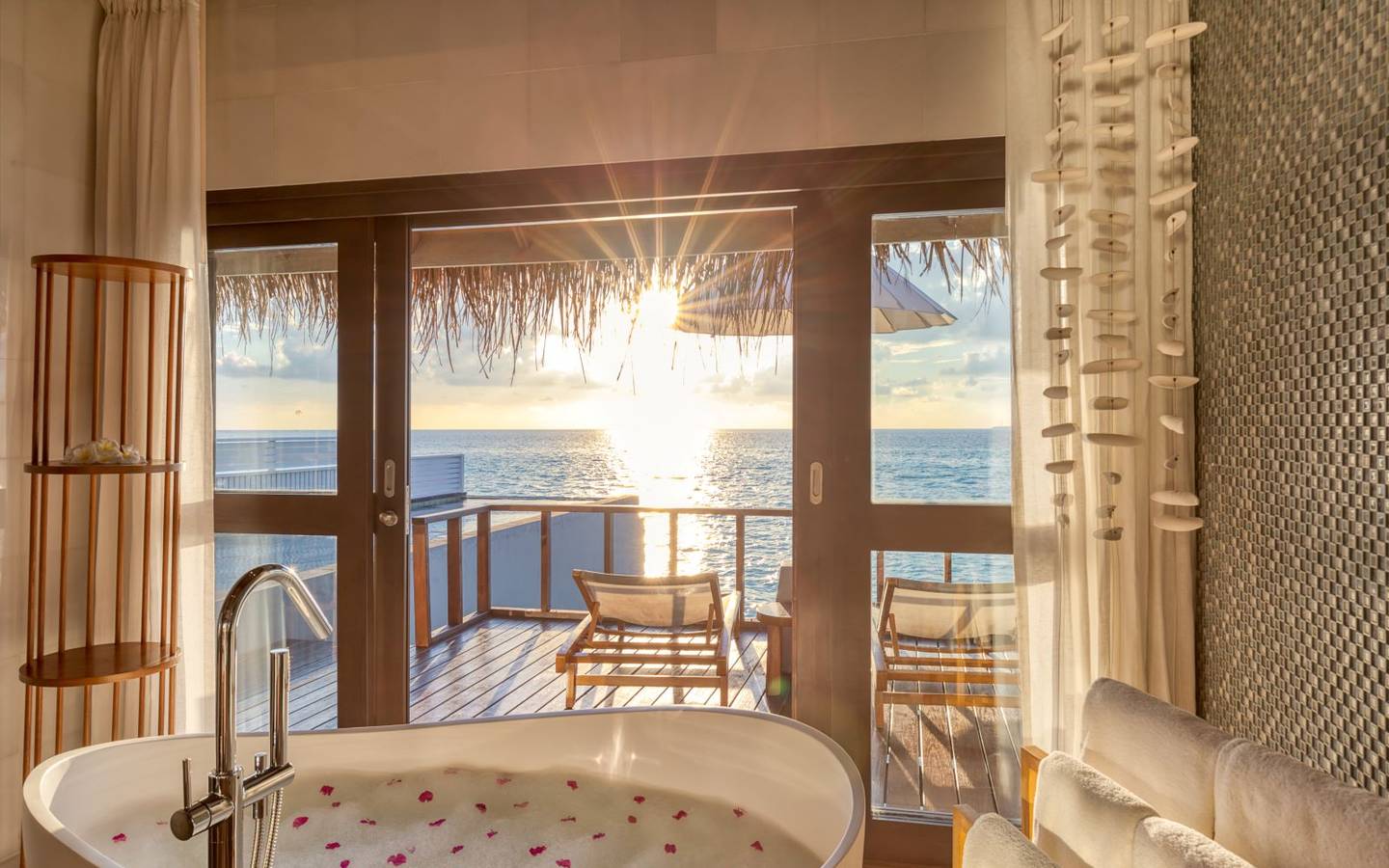ozen-life-maadhoo-maldives-wind-villa-with-pool-bathroom-bath-tube-sunset