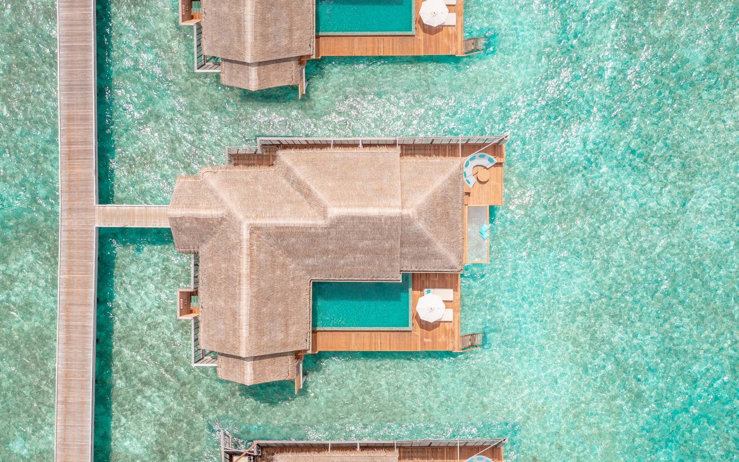 Anantara Kihavah - Aerial Over Water Pool Villas Portrait