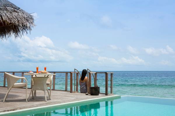 dusit-thani-maldives-accommodation-two-bedroom-ocean-pavilion-bedroom-lifestyle