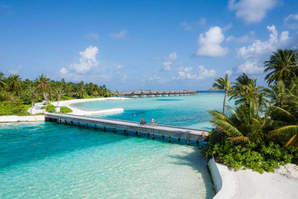 Niyama Private Islands - Bridge with couple cycling
