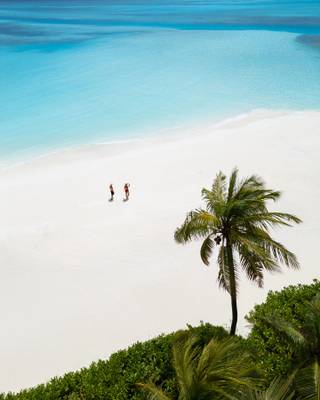 Couple walking on the Beach at Niyama Maldives